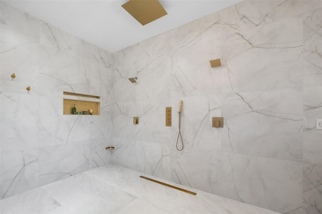 bathroom featuring tiled shower