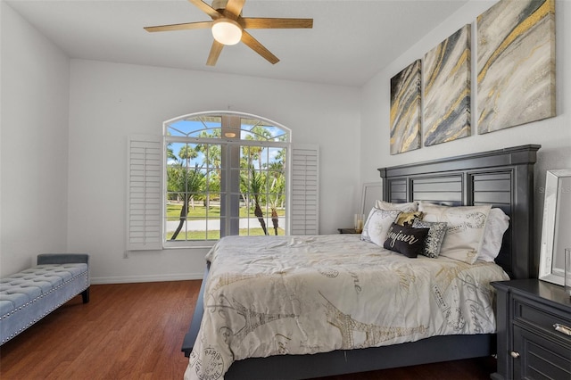 bedroom with dark wood-type flooring, ceiling fan, and french doors