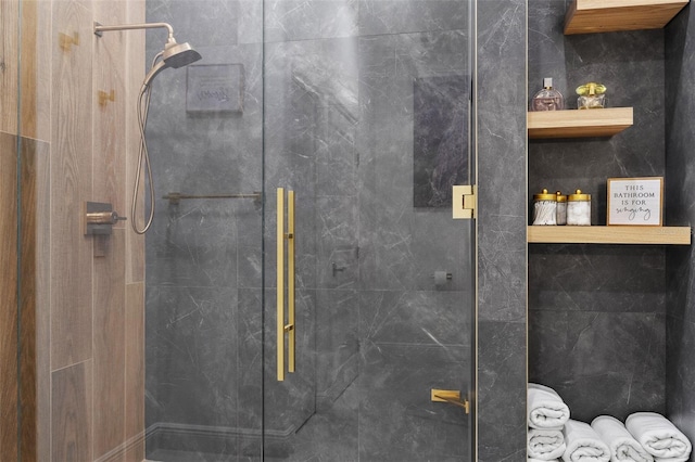 bathroom with a shower with shower door