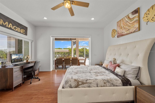 bedroom with ceiling fan, light hardwood / wood-style floors, and access to outside