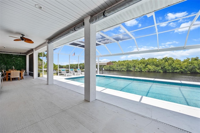 view of pool featuring a patio, a lanai, and ceiling fan