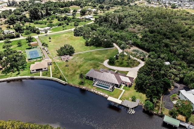 birds eye view of property with a water view