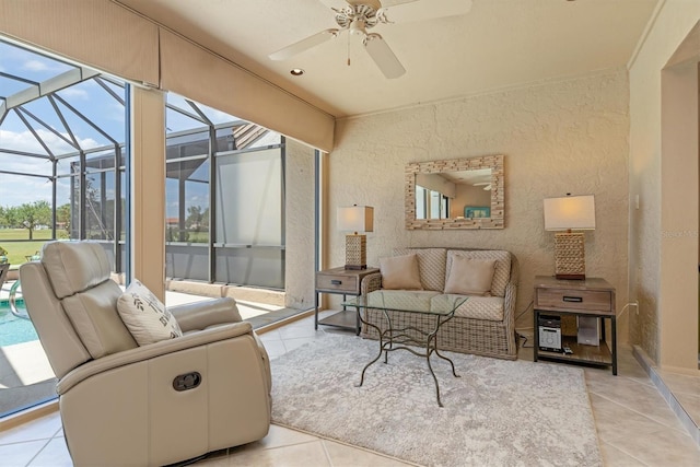 living room featuring ceiling fan and light tile patterned floors