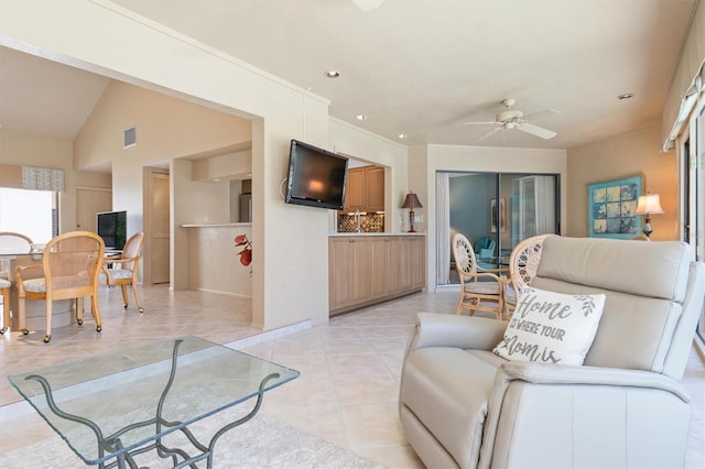 living room featuring light tile patterned floors and ceiling fan