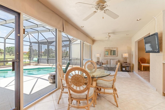 sunroom with ceiling fan and a healthy amount of sunlight