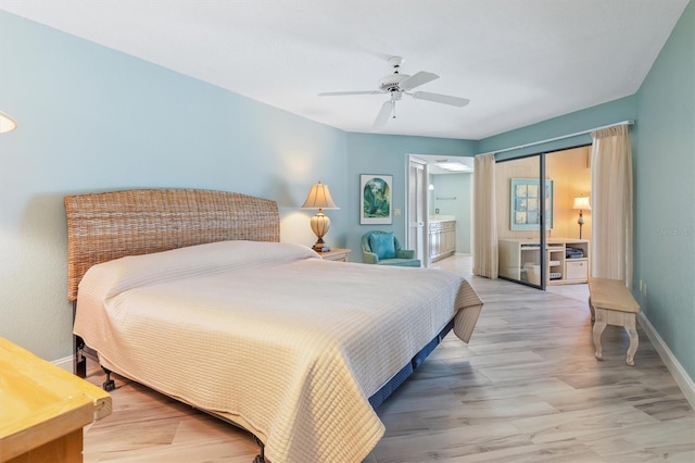 bedroom featuring connected bathroom, ceiling fan, and hardwood / wood-style flooring