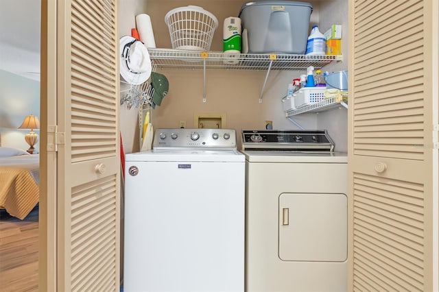 washroom with washing machine and clothes dryer