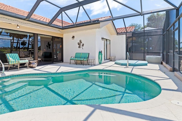 view of swimming pool with a lanai and a patio area