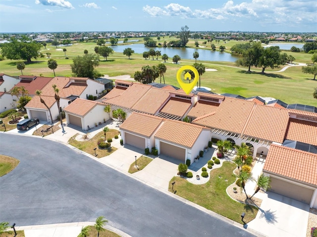 birds eye view of property with a water view