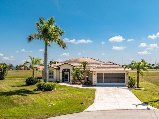 view of front of property with a garage and a front yard