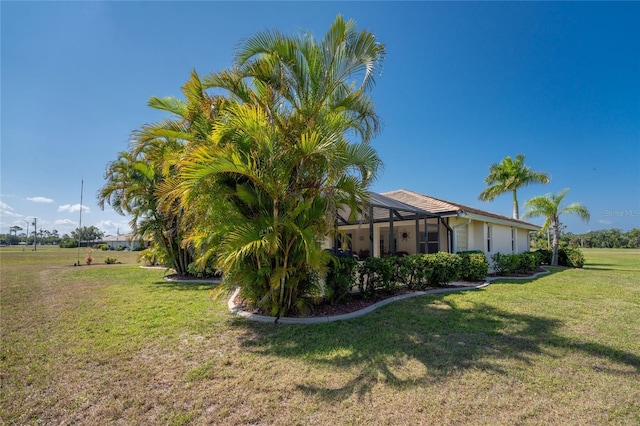 view of yard with a lanai