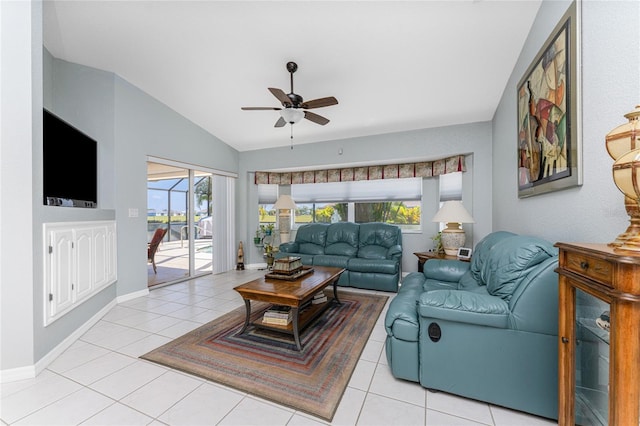 living room with vaulted ceiling, light tile patterned flooring, and plenty of natural light