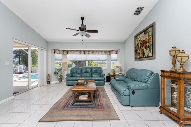 tiled living room with vaulted ceiling and ceiling fan