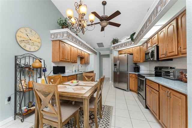 kitchen featuring tasteful backsplash, sink, stainless steel appliances, and light tile patterned flooring