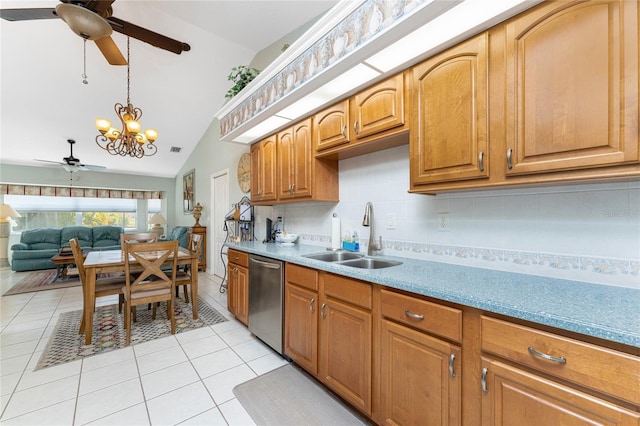 kitchen with sink, light tile patterned floors, tasteful backsplash, vaulted ceiling, and stainless steel dishwasher