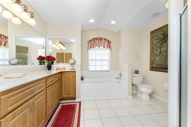 full bathroom with vanity, vaulted ceiling, tile patterned floors, independent shower and bath, and toilet