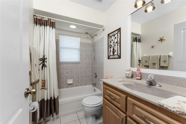 full bathroom featuring shower / bath combo, vanity, tile patterned floors, and toilet