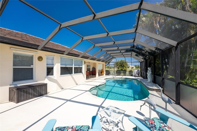 view of pool featuring a lanai and a patio area