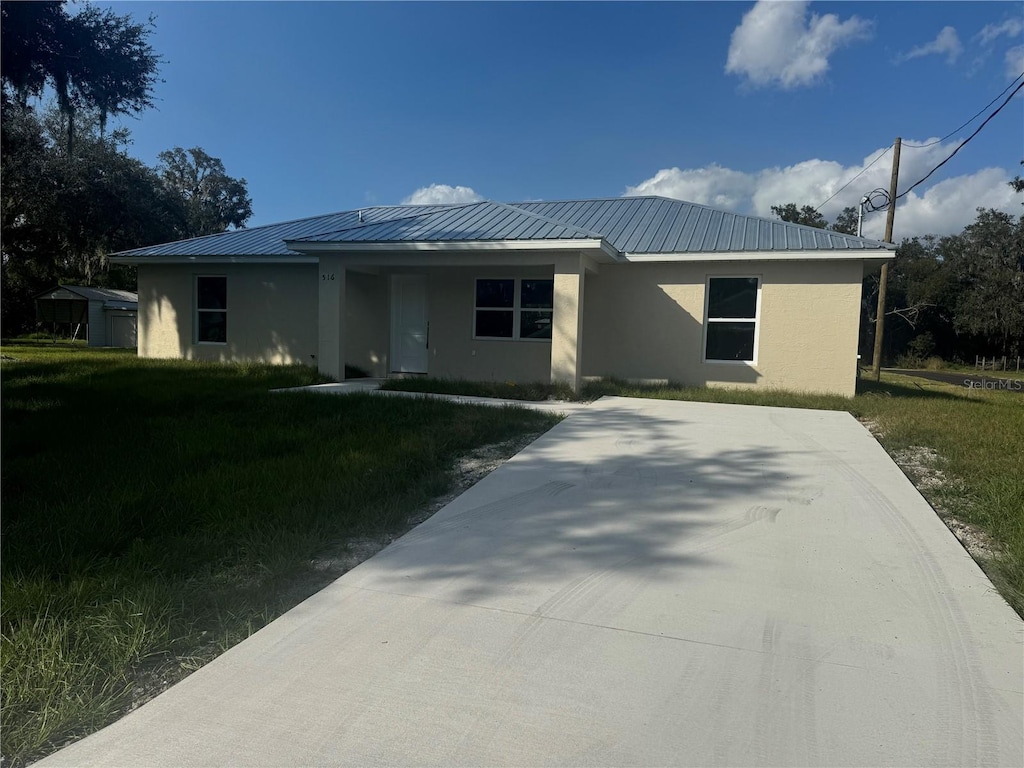 view of front of home with a front yard