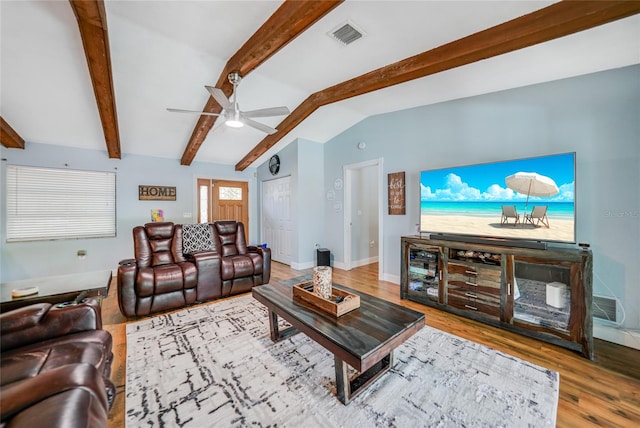 living room featuring ceiling fan, hardwood / wood-style floors, and lofted ceiling with beams