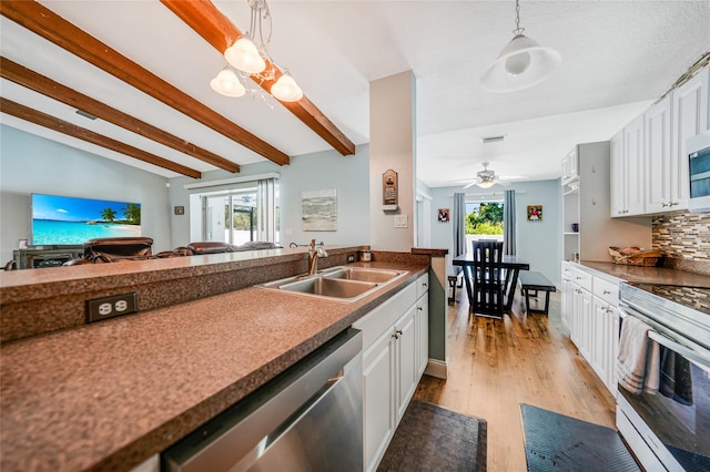 kitchen with white appliances, sink, hanging light fixtures, light hardwood / wood-style flooring, and white cabinetry