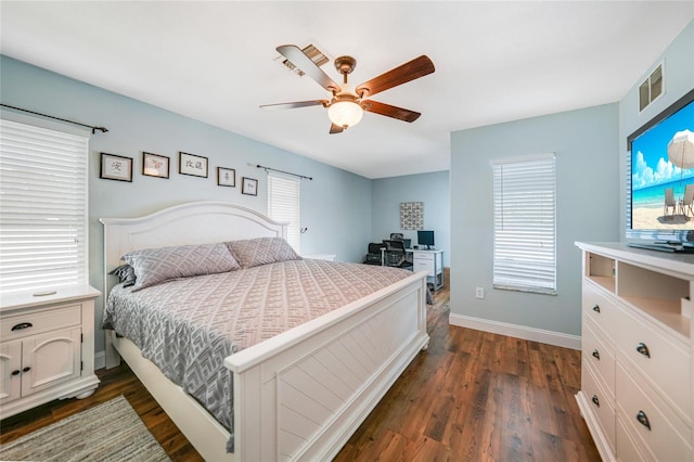 bedroom with dark hardwood / wood-style floors and ceiling fan