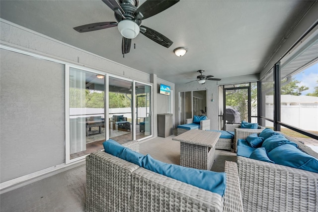 sunroom with ceiling fan and a healthy amount of sunlight