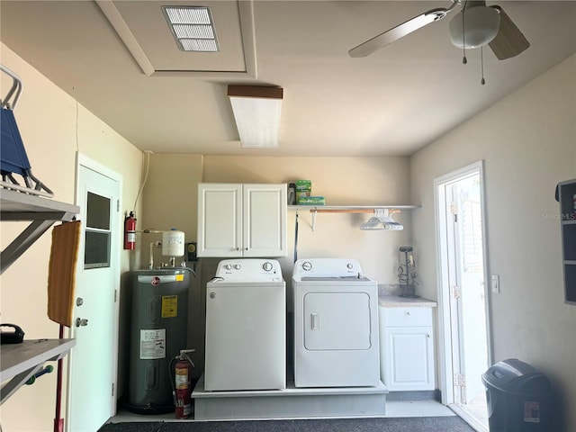 laundry room featuring a ceiling fan, visible vents, water heater, washer and dryer, and cabinet space