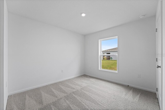 empty room with carpet flooring