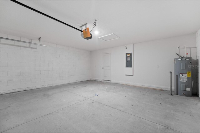 garage featuring water heater, a garage door opener, and electric panel