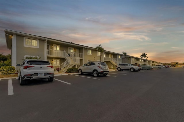 view of parking at dusk