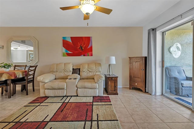 tiled living room featuring ceiling fan