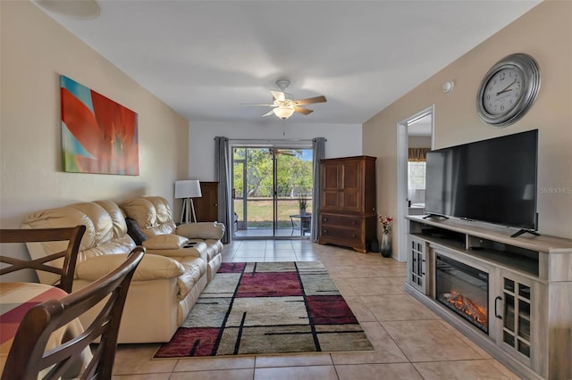 tiled living room featuring ceiling fan