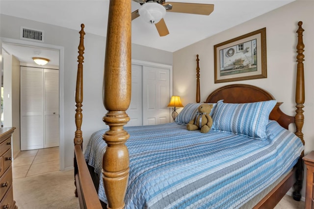 carpeted bedroom featuring ceiling fan and a closet