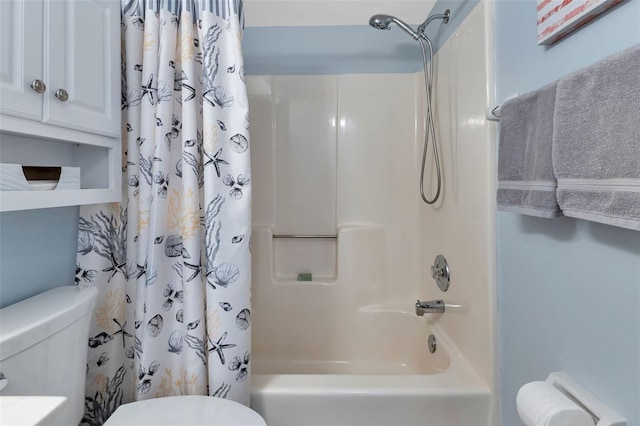 bathroom with shower / bath combo and toilet