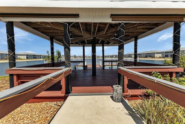 view of dock featuring a deck with water view