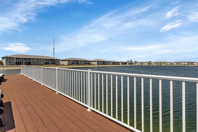 view of dock featuring a deck with water view