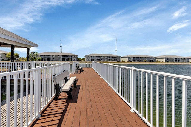 view of dock with a deck with water view