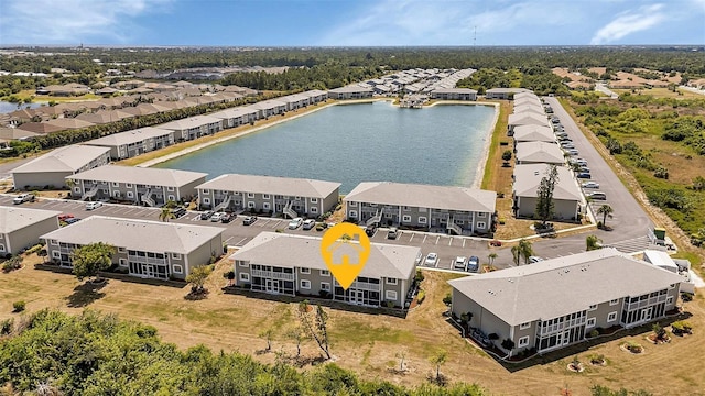 drone / aerial view with a water view