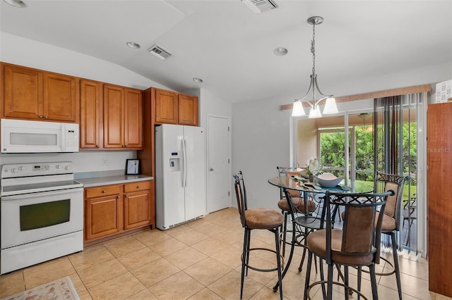 kitchen with light tile patterned floors, white appliances, a notable chandelier, decorative light fixtures, and vaulted ceiling