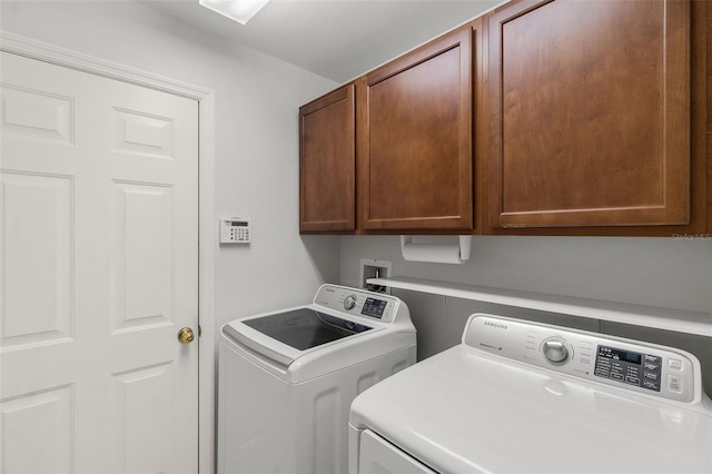 laundry area with cabinets and washer and dryer