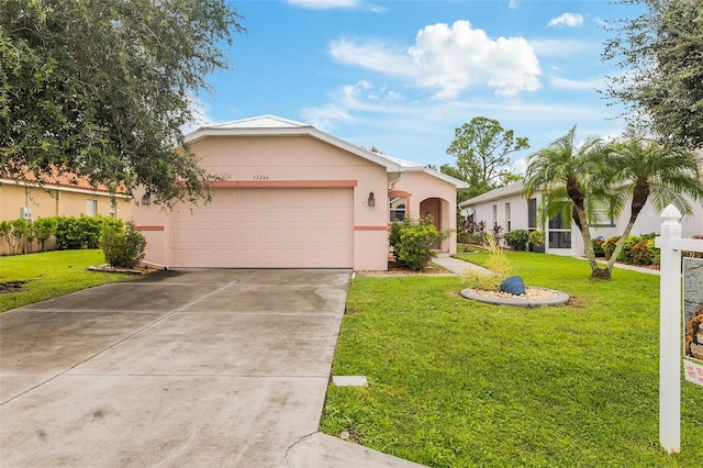 view of front of property featuring a garage and a front lawn