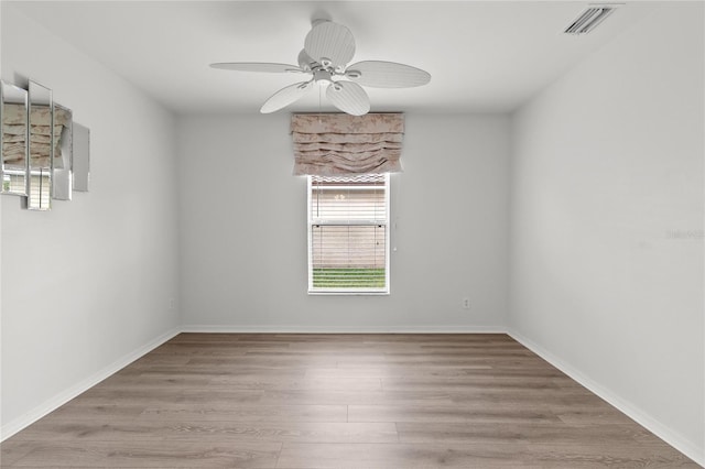 unfurnished room featuring ceiling fan and light wood-type flooring