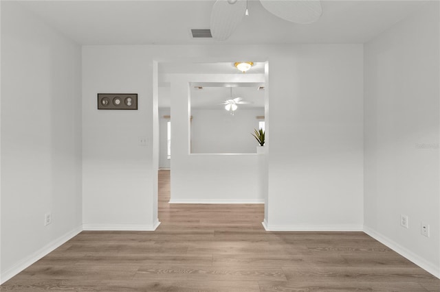 unfurnished room featuring hardwood / wood-style flooring and ceiling fan