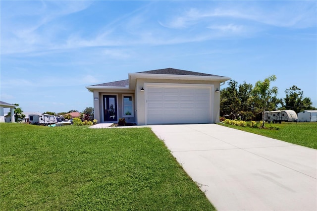 view of front of home featuring a garage and a front lawn