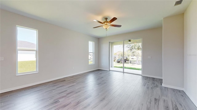 unfurnished room featuring light hardwood / wood-style floors and ceiling fan