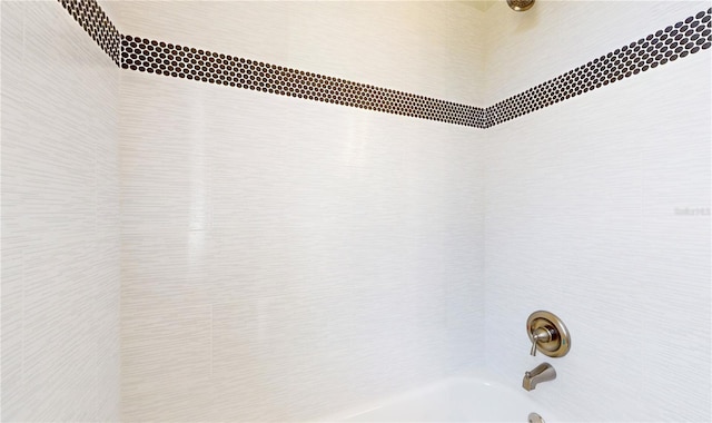 details featuring shower / bathing tub combination