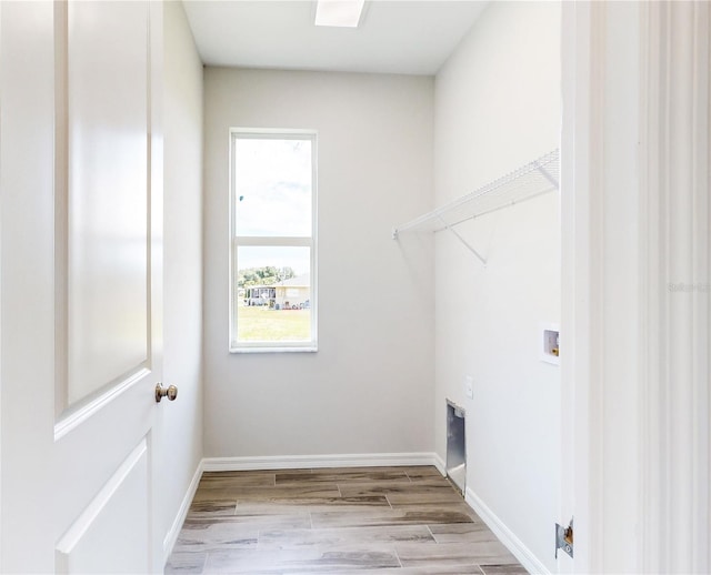 washroom featuring light hardwood / wood-style floors and hookup for a washing machine