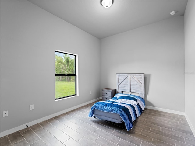 bedroom with hardwood / wood-style flooring