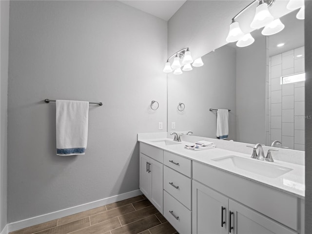 bathroom featuring vanity and a tile shower